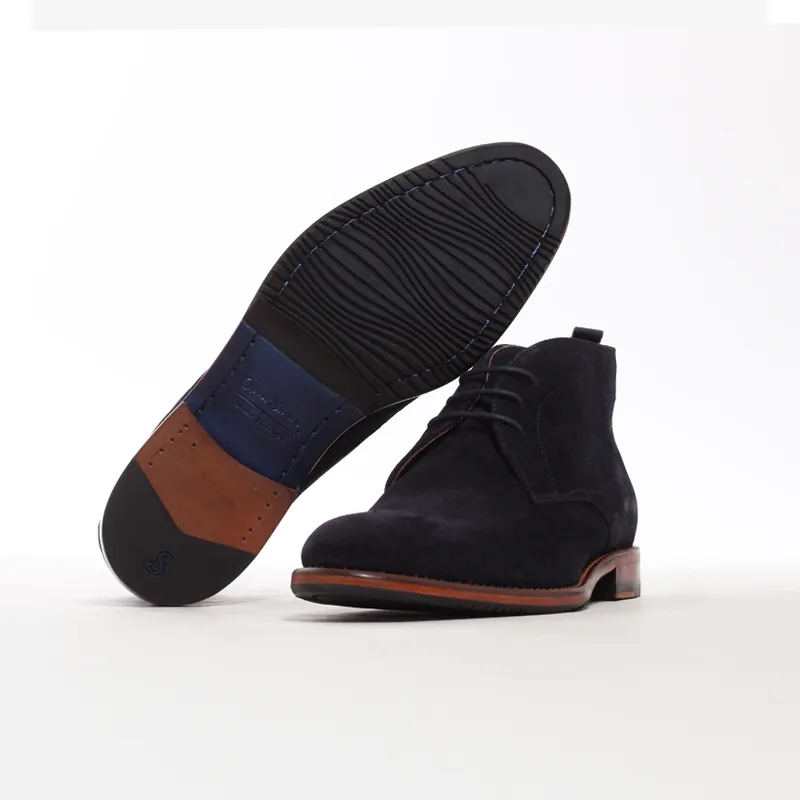 A pair of navy blue boots