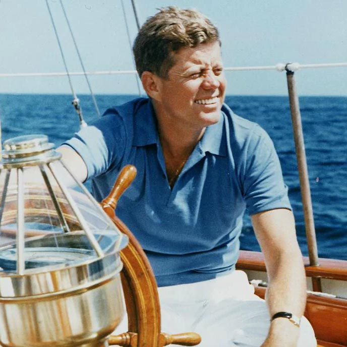 JFK Wearing a polo shirt on a boat