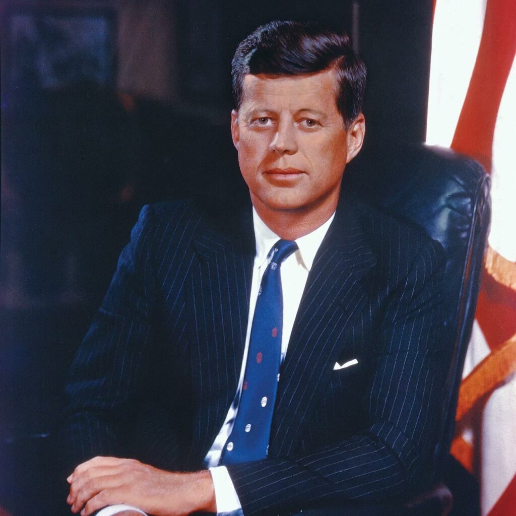 JFK wearing a suit in the oval office
