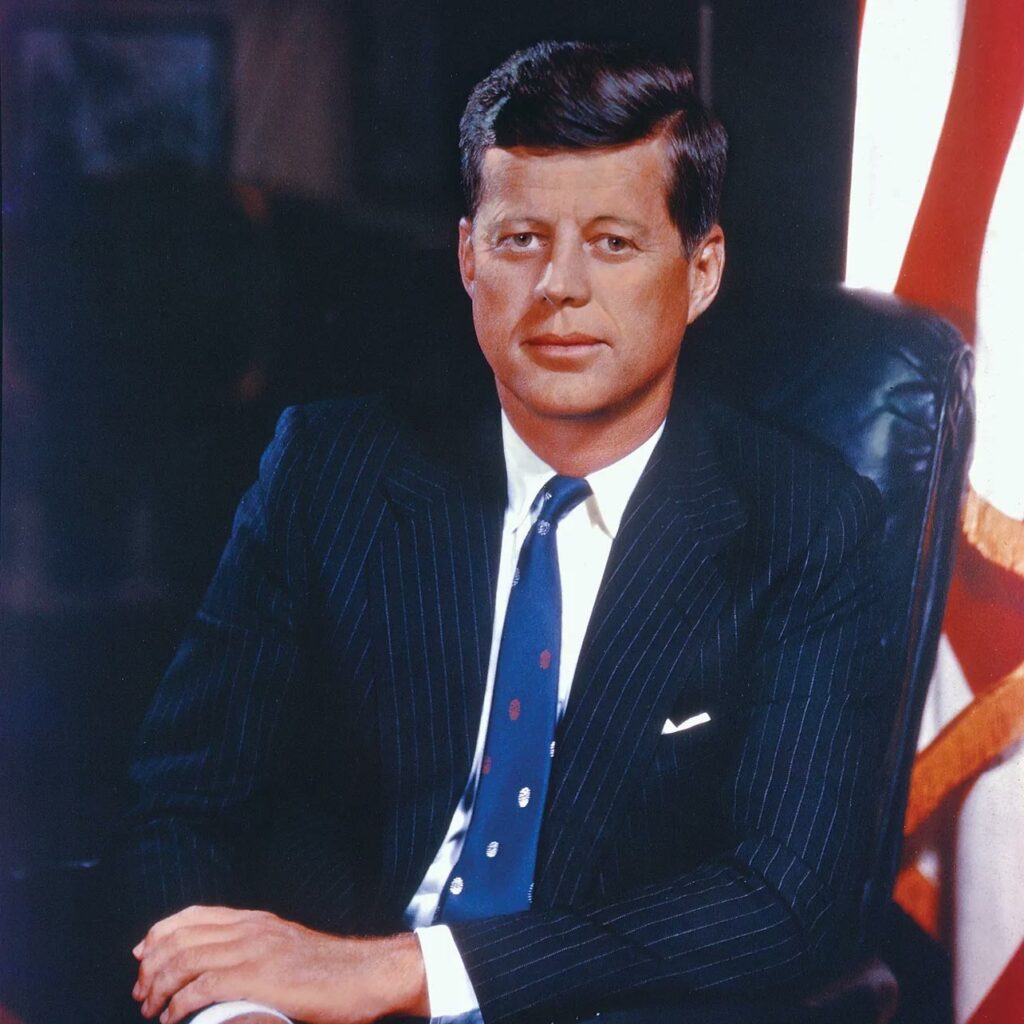 JFK wearing a suit in the oval office