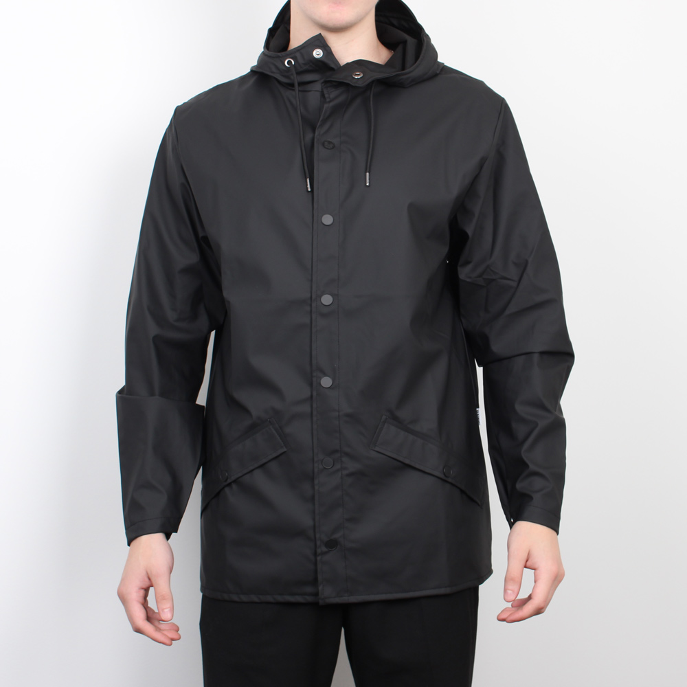 Man standing wearing black waterpoof jacket