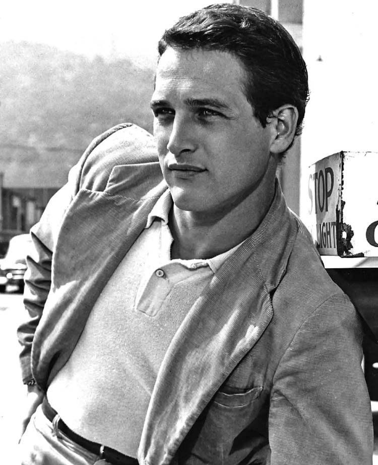 Paul Newman wearing a blazer looking into the distance