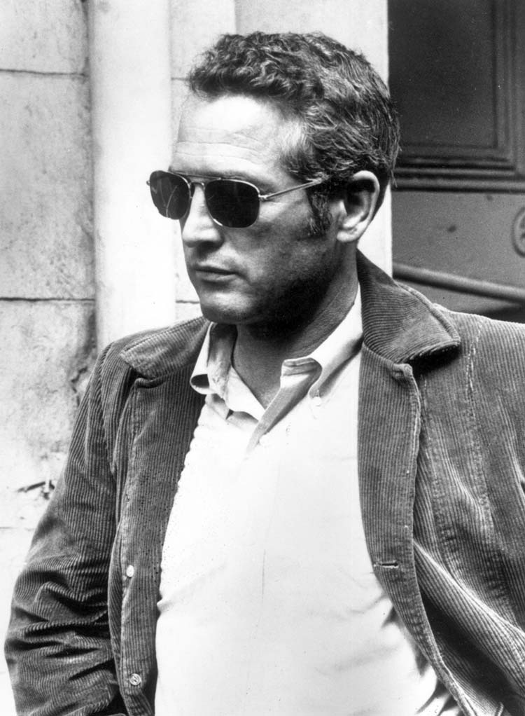 Paul Newman Wearing a leather jacket and sunglasses