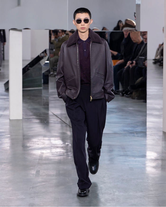 Model walking in purple jacket