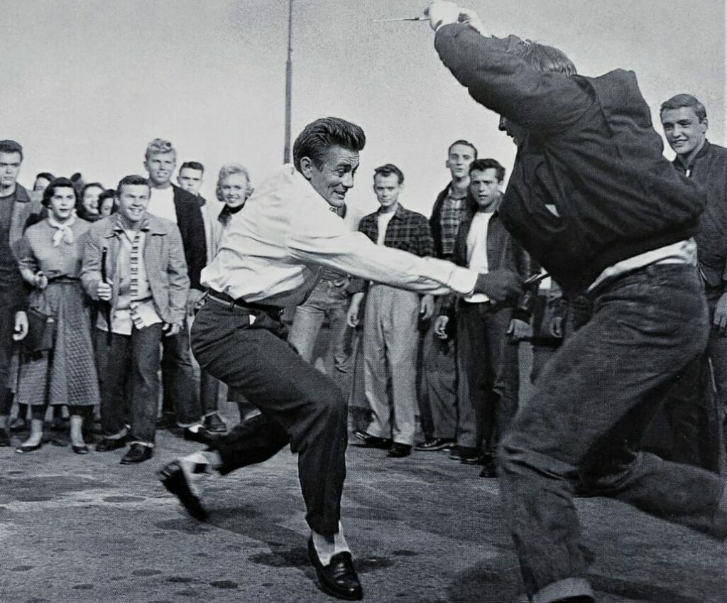 Two men fighting in black and white