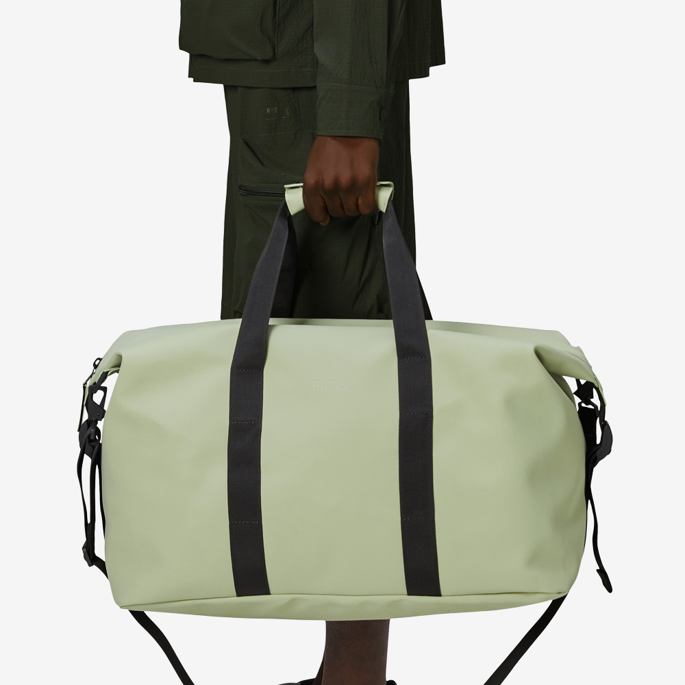 Model carrying green bag