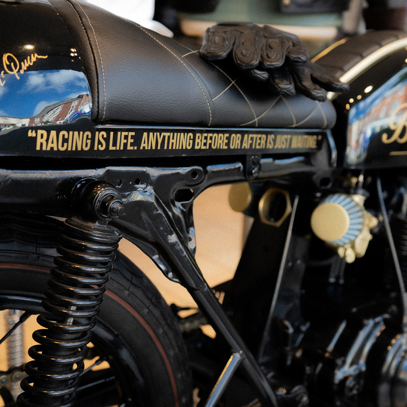 A closeup image of text printed onto a motorcycle