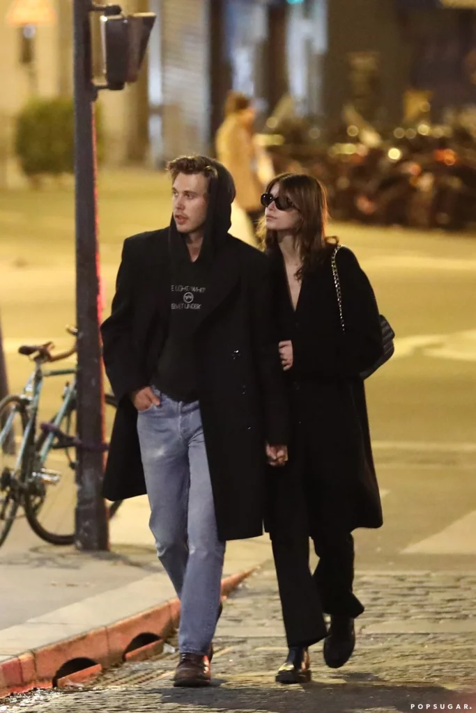 Man and woman walking down street together