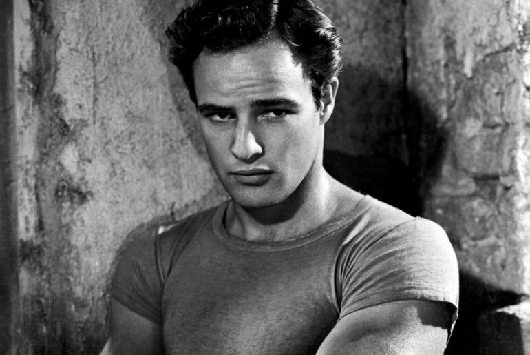 Man wearing t shirt with his arms crossed