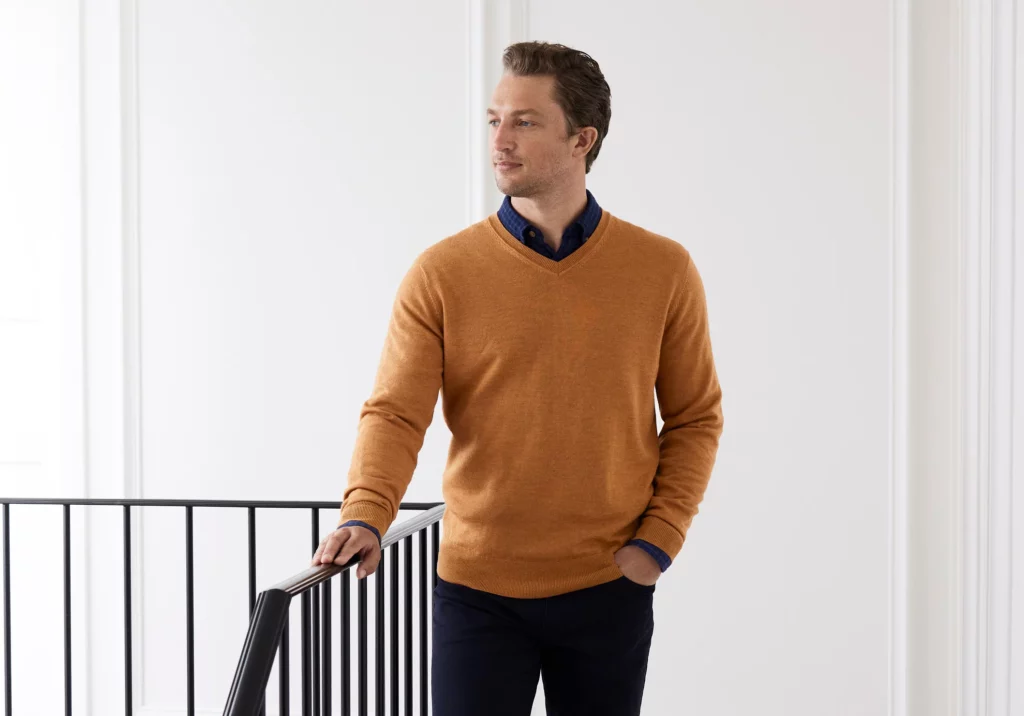 Man posing for a photo with his hand in his pocket.