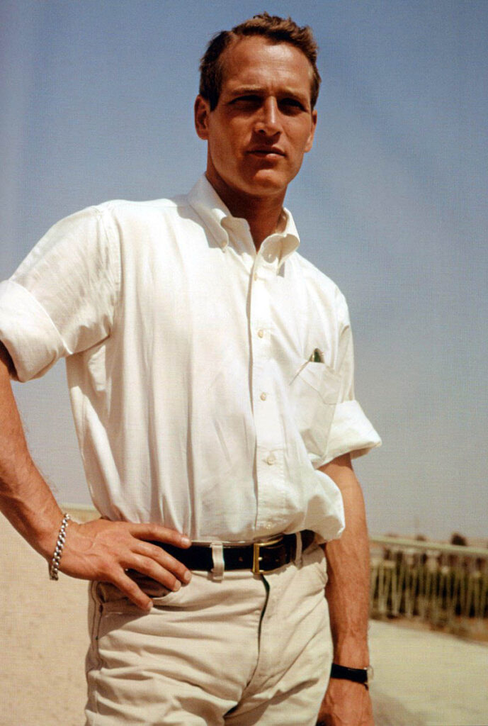 A man posing for a photo with his hand on his hip