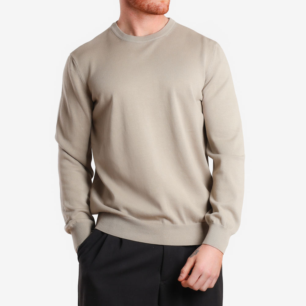 Man walking with his hand in his pocket.