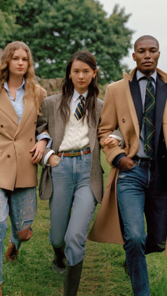 Three smartly dressed people posing for a photo