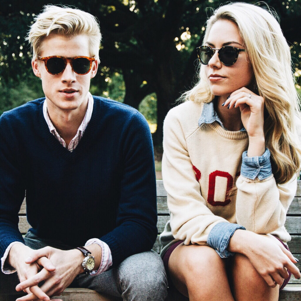 A smartly dressed man and woman pose for a photo