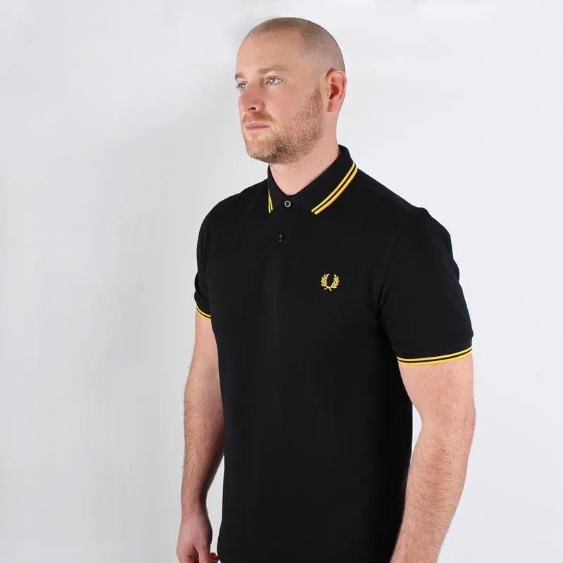 fred perry polo shirt black and yellow